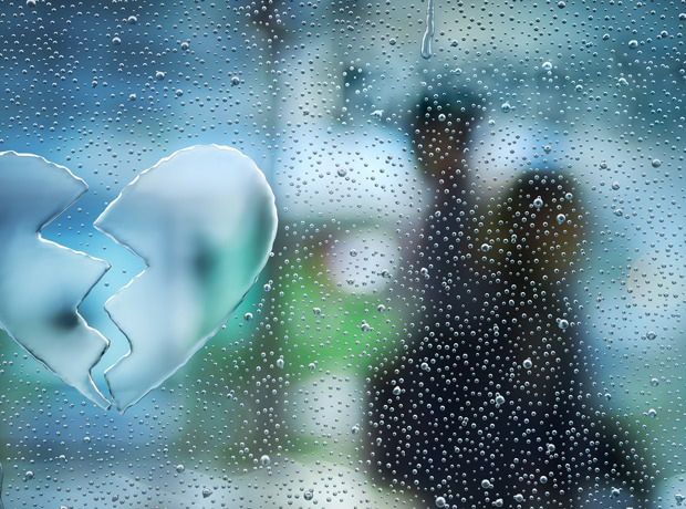 Broken Heart in water droplets on window